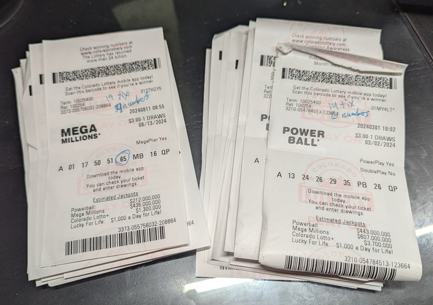 two more piles of non-winning lottery tickets