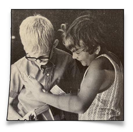 John Settlage and friend with polaroid camera