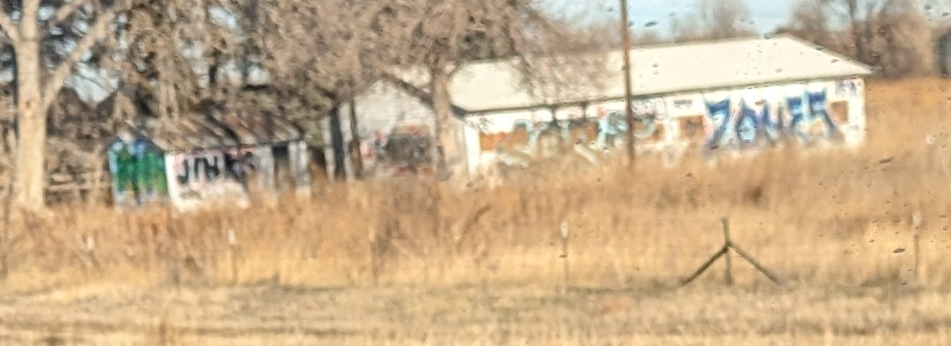 outbuildings covered in graffiti